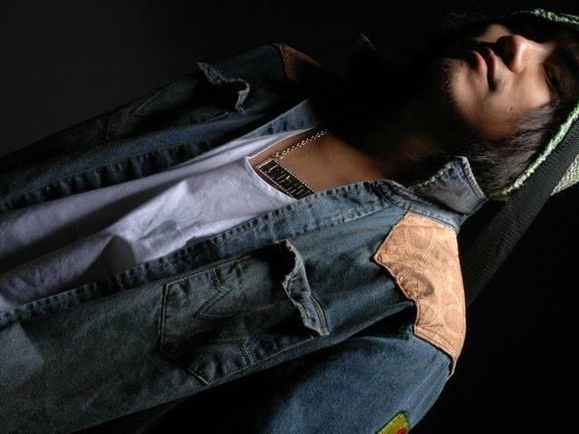 The denim jacket, showing its contrast lining