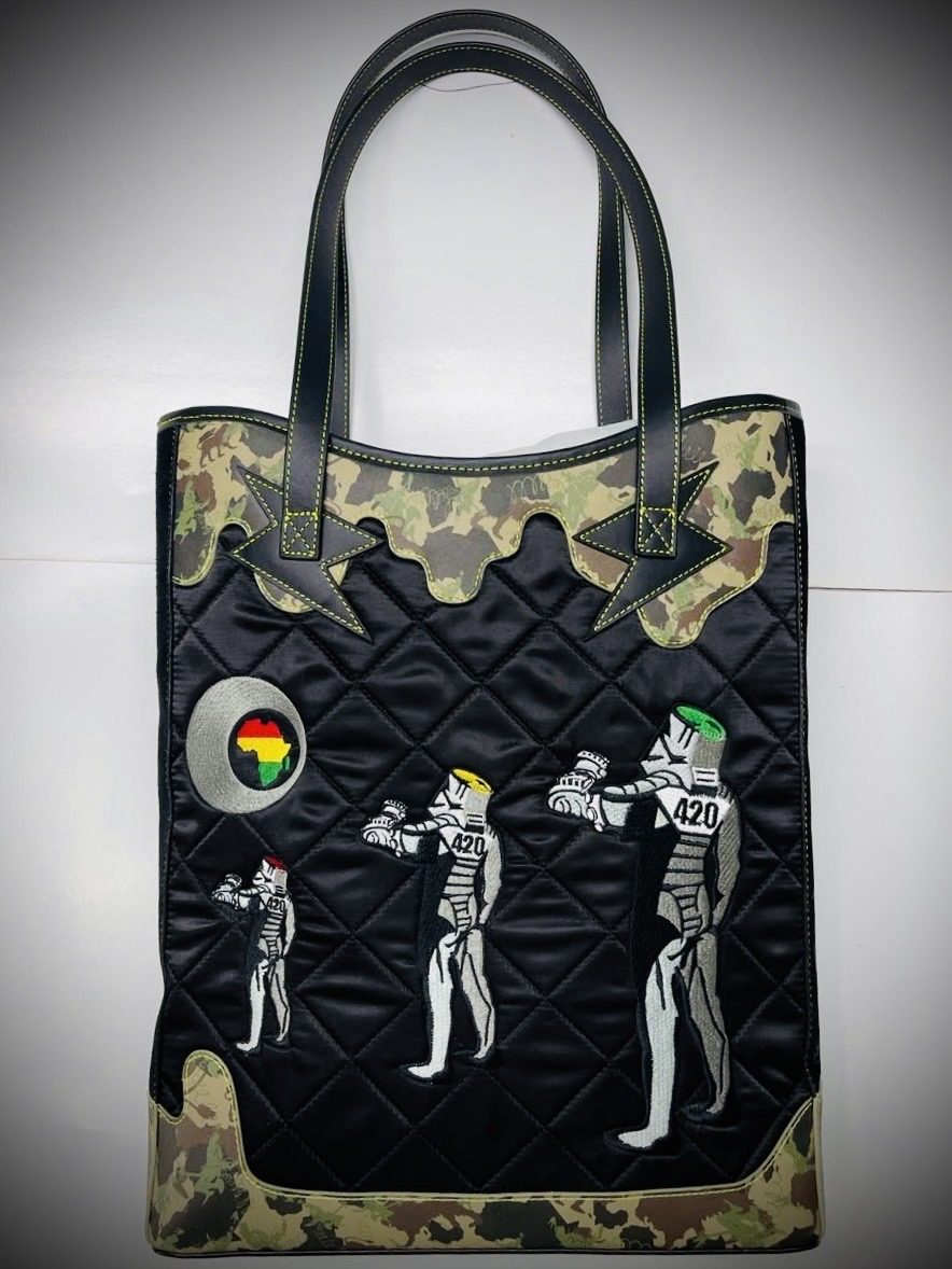 Black quilted tote with camo panels and trooper embroidery