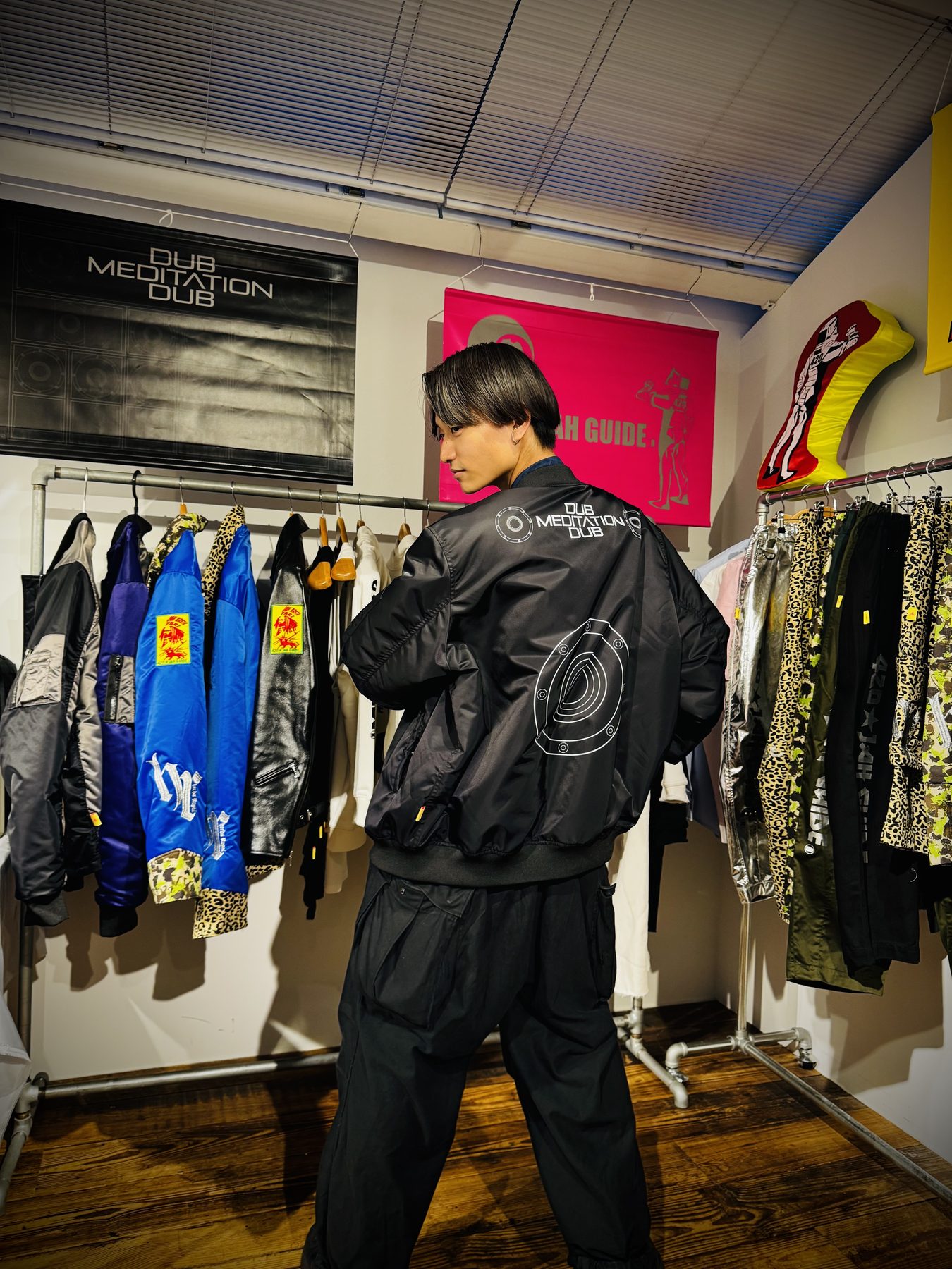 DUB MEDITATION DUB — an all-black look photographed from behind at the 2026 exhibition